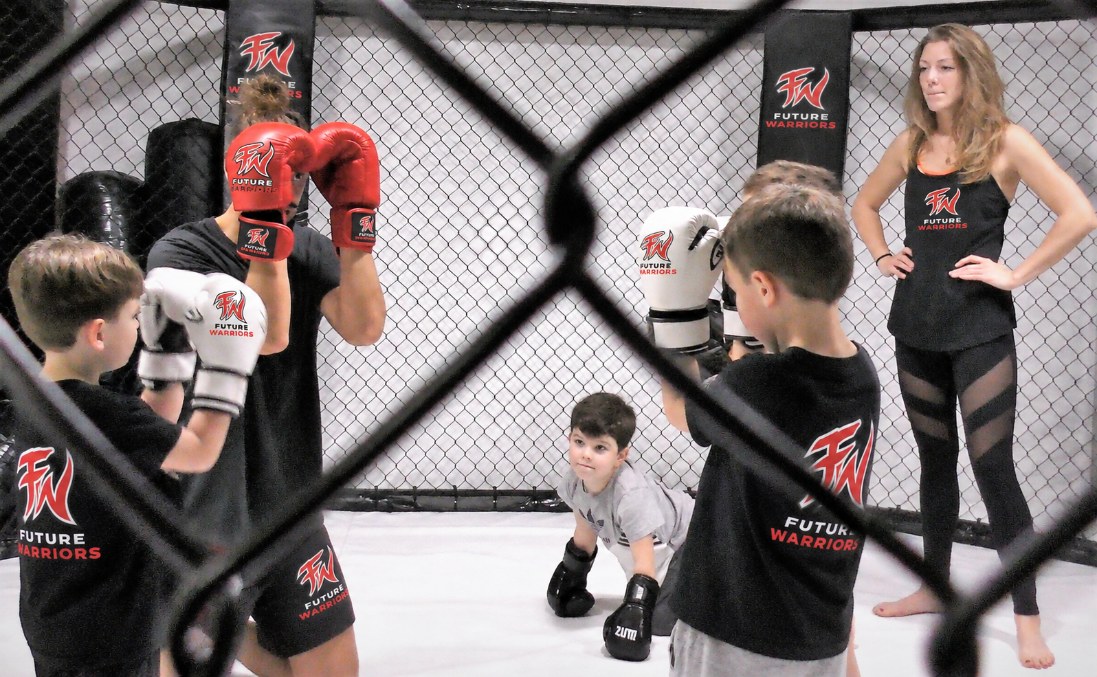 Young students practising their guard in a supervised session